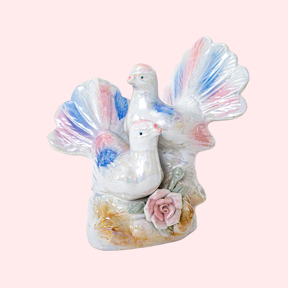 Second-hand, decorative ceramic figurine representing two doves with colorful wings and tails. It has an iridescent glaze.