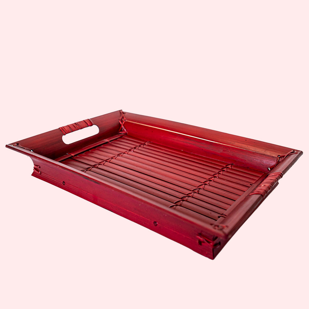 A vintage rectangular bamboo tray painted red. 